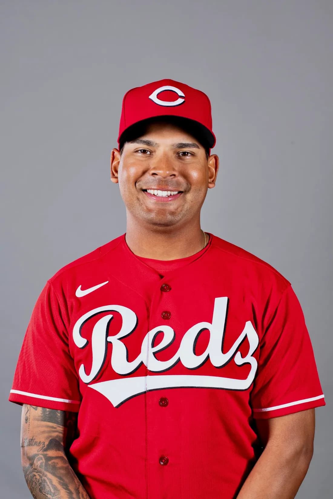 Portrait of Plaz in a Cincinnati Reds cap and jersey