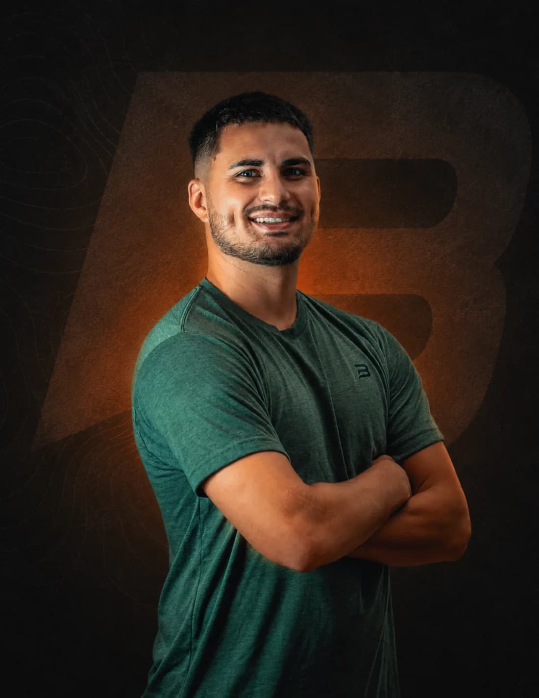 Jacobo Gomez with his arms crossed in front of the ONBASE Athlete mark